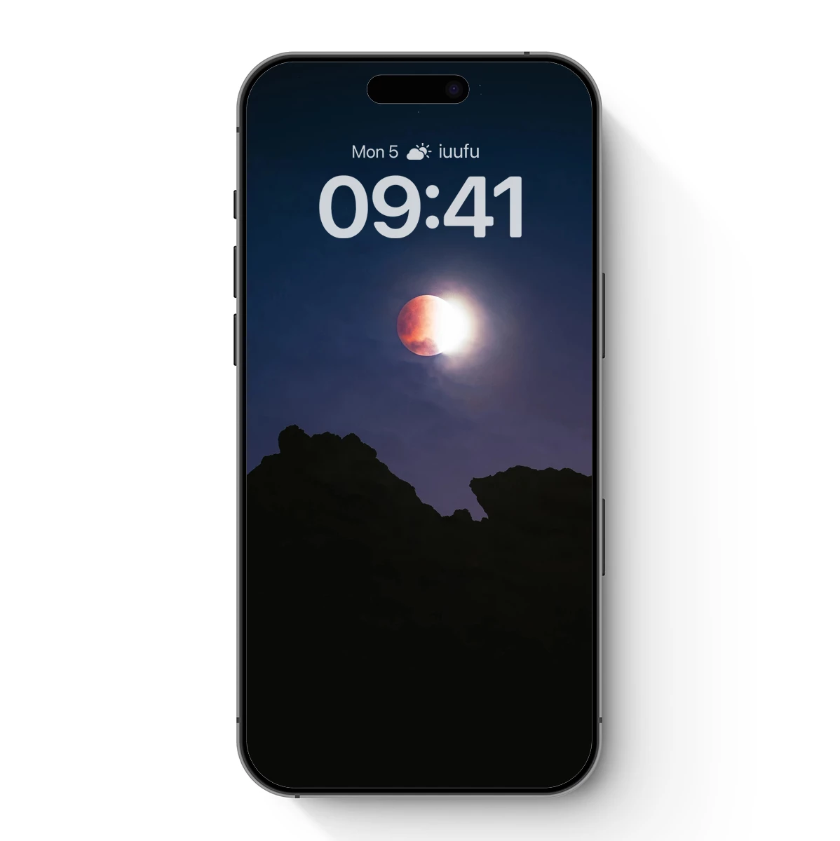 Eclipse Over Silhouetted Peaks